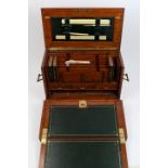 Good quality Edwardian oak writing compendium of box form with flanking carrying handles and
