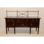 Regency mahogany sideboard with brass back rail, crossbanded decoration and rope carved borders,