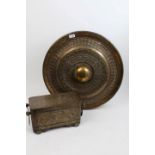 Large Eastern tooled brass gong centred by projecting dome within concentric embossed lotus bands,