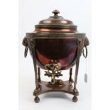 Regency copper samovar of oval form, with lion's head bosses and ring handles, Greek key border,