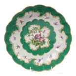 18th century Worcester fluted junket dish with polychrome painted exotic bird decoration on green