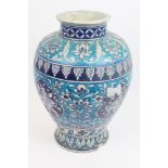 Old Turkish pottery baluster-shaped vase with blue glazed floral and figure decoration,
