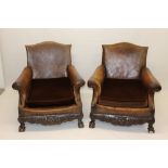 Fine pair of early 20th century close-stud leather upholstered and carved mahogany club armchairs,