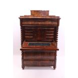 Mid-19th century Continental figured mahogany secretaire abattant surmounted by serpentine shaped