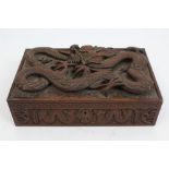 Late 19th century Indian carved wooden cigar box decorated in high relief with dragons,