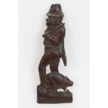 19th century softwood relief folk art carving depicting figure and a pig inscribed below 'Pat
