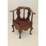 George II walnut corner chair with shaped bar back raised on solid vase splats and columns,