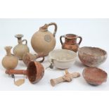 Collection of ancient and later Greco-Cypriot pottery vessels including vases, jugs, ladle,