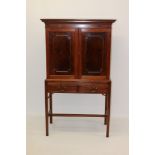 Good quality George III-style mahogany cocktail cabinet with dentil moulded cornice and enclosed by