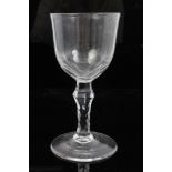 Large Georgian wine glass with facet cut bowl and facet cut swollen stem on splayed foot,