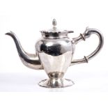Peruvian white metal coffee pot of inverted baluster form, with scroll handle with ebony insulators,
