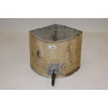 George III lead cistern of bowed triangular form, embossed 'I H 1763' with projecting brass tap,