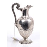 Victorian silver Etruscan revival-style jug of baluster form, with half-fluted decoration,