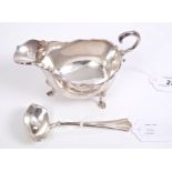 1920s silver sauce boat of conventional form, with open scroll handle,