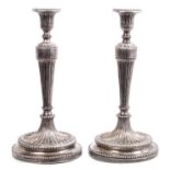 Pair late 18th / early 19th century Continental white metal candlesticks in the neoclassical style,