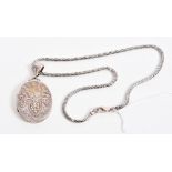 Victorian silver oval locket with applied gold and silver floral decoration (Birmingham 1882), 55mm,