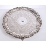 George IV silver salver of circular form, with piecrust border and foliate scroll rim,