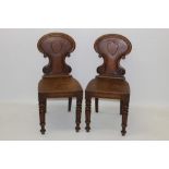 Pair of Regency oak hall chairs,