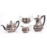 Late Edwardian / early George V silver four piece tea set - comprising teapot of compressed