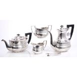 Late Victorian / Edwardian four piece silver tea set - comprising teapot of bellied form,