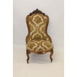 Victorian carved walnut nursing chair with balloon-shaped show-wood back with crown and conjoined E.