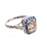 Diamond and sapphire ring, the cushion-shape old cut diamond of champagne colour,