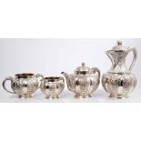Late 19th century Indian silver four piece tea / coffee set - comprising teapot of melon form,