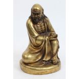 Chinese gilt bronze figure of a crouching deity holding a censor,