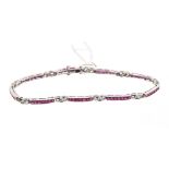 White gold bracelet with a line of synthetic rubies interspaced by diamonds, stamped - 750,