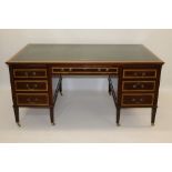 Substantial Edwardian mahogany and boxwood line-inlaid desk with leather inset moulded top,