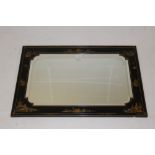 Early 20th century black lacquered and chinoiserie decorated wall mirror,