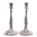 Pair Victorian silver plated candlesticks with tapering stems and Gothic-style scroll and foliate