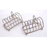 Victorian silver six-division toast rack of shaped form, with central carrying handle,