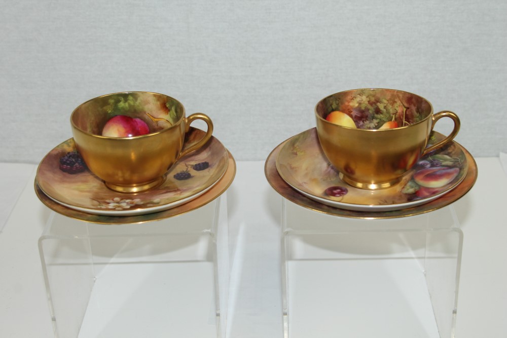 Pair of Royal Worcester Cabinet Trios - comprising cups,