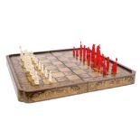 Good quality mid-19th century Chinese carved and stained ivory chess set - the king 9cm high,