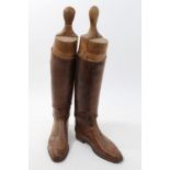 Pair of brown leather hunting boots with wooden trees