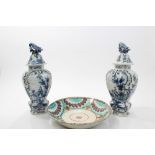 Pair 19th century Dutch Delft blue and white pottery vases and covers with bird knops,