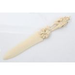 19th century Continental carved ivory paper knife with finely carved surmount depicting an Alpine