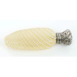 19th century silver mounted glass scent bottle of cut spiral form,