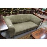 Victorian settee with green upholstery on turned legs