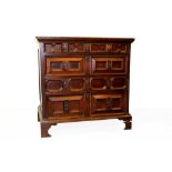 Late 17th century oak geometric moulded chest with projecting top and four long geometric moulded