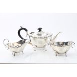 Edwardian silver bachelors tea set - comprising teapot of cauldron form, with scroll border,