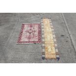 Tribal rug with central cruciform medallions and zoomorphic ornament in borders,