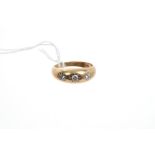 Gold (9ct) three stone diamond ring with three brilliant cut diamonds in Gypsy setting.