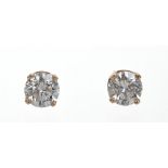 Pair diamond single stone stud earrings,