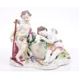 18th century Meissen group of two cherubs with drums and cornucopia,