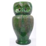 Late 19th century green glazed art pottery stick stand in the form of an owl with brown eyes and