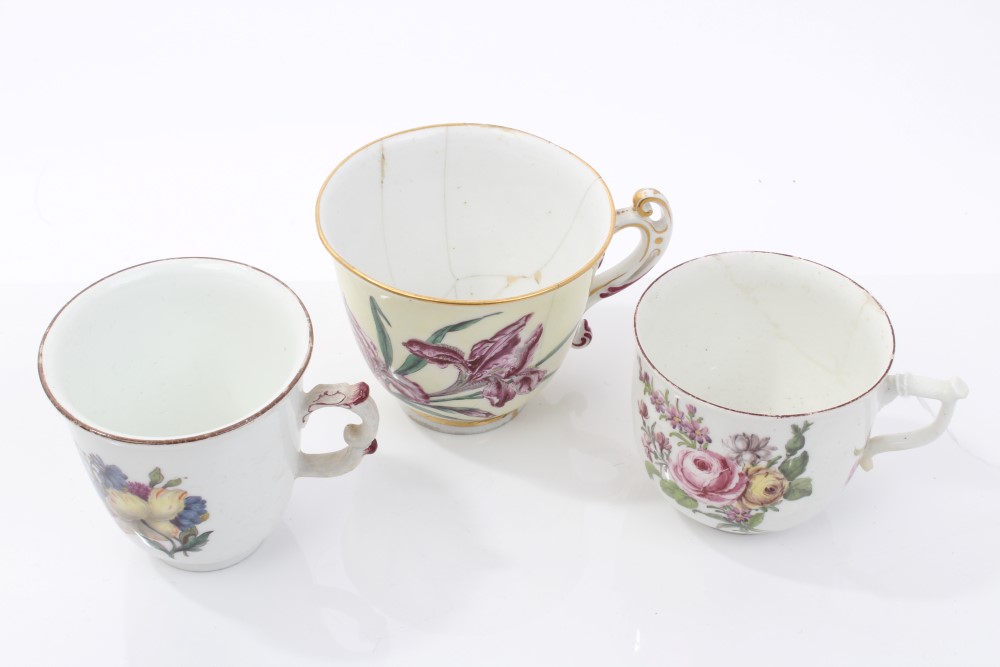 Three 18th century Chelsea Derby polychrome coffee cups with finely painted floral sprays