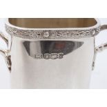 Contemporary silver sauce bottle holder of square form,