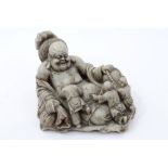 Chinese carved soapstone figure of Buddha in reclining pose,